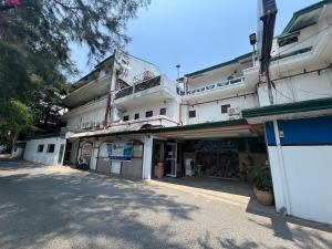 an empty street with a white building at Subiza Beach Resort in Olongapo +57 photos