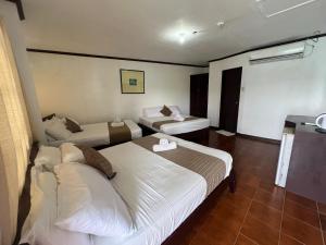 Postel nebo postele na pokoji v ubytování Subiza Beach Resort