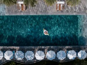 an overhead view of a pool of water with boats at Hoi An Royal Beachfront Resort & Villas in Dien Ban
