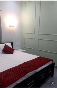 Ένα ή περισσότερα κρεβάτια σε δωμάτιο στο Olive Inn Apartment