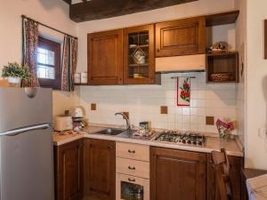 A kitchen or kitchenette at Farmhouse with air conditioning, private terrace and pool