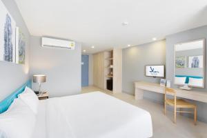Xen Hotel Nakhon Pathom - SHA PLUS客房内的一张或多张床位