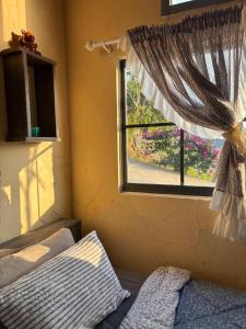 a bedroom with a window with a bed at Hạ Hoàng Hôn House & Coffee in Da Lat +45 photos
