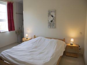 Rúm í herbergi á Contemporary Holiday Home in Houffalize with Private Garden