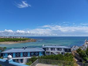 a view of the ocean from the balcony of a house at Apartment in Audierne near Trescadec Beach in Audierne