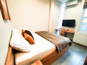 Voodi või voodid majutusasutuse Casa de Java Cirebon toas