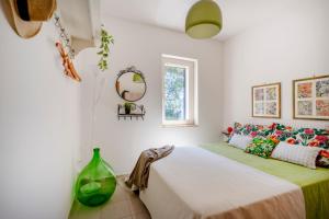 Postel nebo postele na pokoji v ubytování Il Vecchio Leccio