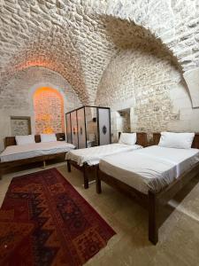 Ένα ή περισσότερα κρεβάτια σε δωμάτιο στο Taştepeler Konak