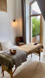 a bedroom with a bed with a window and a table at Five and You in Josse