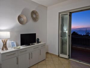 TV a/nebo společenská místnost v ubytování Casa Vacanze-Halivita