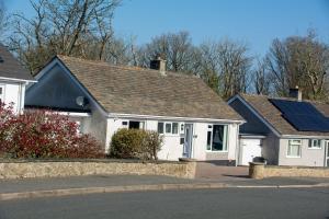 a house with solar panels on the roof at 80 Breeze Hill in Benllech