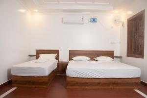 Postel nebo postele na pokoji v ubytování Kps Resort