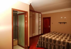 a bedroom with a bed and a sliding glass door at Un-Furnished Rooms Contractors Accomodation at 66 Pongola Street, MIDDELBURG, Mpumalanga in Middelburg +9 photos