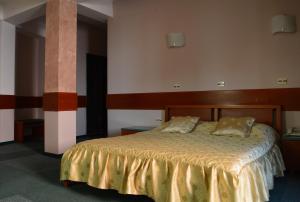 Ένα ή περισσότερα κρεβάτια σε δωμάτιο στο Hotel Cingo