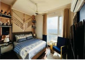 a bedroom with a bed and a chair and a window at Elysium Tower - LMY Executive Hotel Serviced Apartments Facing Centaurus Mall Islamabad in Islamabad +37 photos
