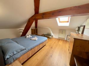 a bedroom with a large bed in a attic at La Casa Del Sole in Terzolas +9 photos