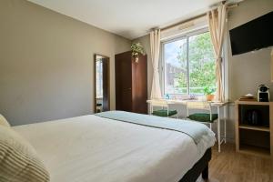 Ένα ή περισσότερα κρεβάτια σε δωμάτιο στο Charming studio, Vauban La Catho, Lille