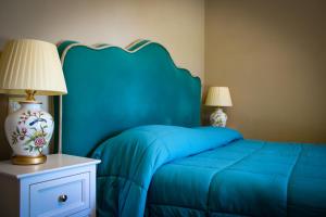 A bed or beds in a room at Antica Quercia Villa & Spa