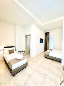 Postel nebo postele na pokoji v ubytování Hotel Paradise Rooms