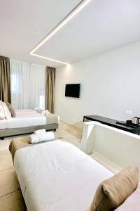 Postel nebo postele na pokoji v ubytování Hotel Paradise Rooms
