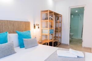 Postel nebo postele na pokoji v ubytování Bamblue Boutique Apartments + 37 fotografií