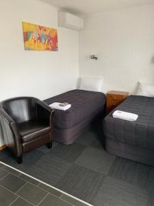 Postel nebo postele na pokoji v ubytování Brooklyne Motel Sanson