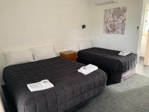 Postel nebo postele na pokoji v ubytování Brooklyne Motel Sanson