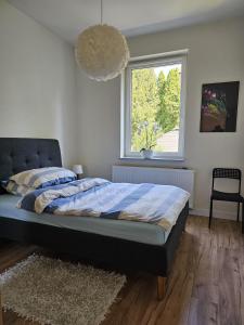 Ένα ή περισσότερα κρεβάτια σε δωμάτιο στο Tabago Studio 23 Nysa Mickiewicza +2 φωτογραφίες