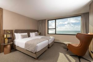 Idou Malabata Beach and SPA客房内的一张或多张床位