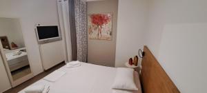 Łóżko lub łóżka w pokoju w obiekcie Luxury Villas 1