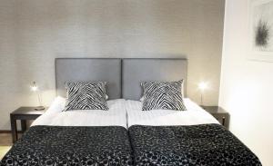 Postel nebo postele na pokoji v ubytování Art Hostel Honkahovi