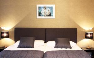 Postel nebo postele na pokoji v ubytování Art Hostel Honkahovi