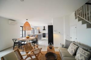 a living room with a couch and a table at Casa El Cholo, Mijas Hideaway in Mijas