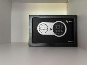 a black and white microwave on a wall at HELEN STUDIOS Loft in Planos