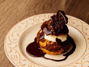 two donuts on a plate on a table at Rivage Hôtel & Spa Annecy in Annecy