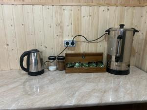 a counter with a blender and a box of food at Sesili Guesthouse in Adishi