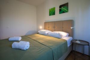 Postel nebo postele na pokoji v ubytování Apartments Gaja Green ap