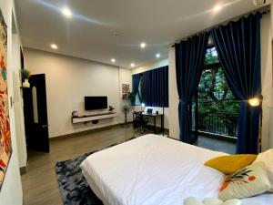 TV/trung tâm giải trí tại Mandala Home & Coliving Space