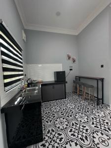 Kuchyň nebo kuchyňský kout v ubytování Yash Cottage Taiping Homestay