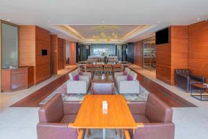 a conference room with tables and chairs in a room at Hyatt Regency Dubai - Corniche in Dubai