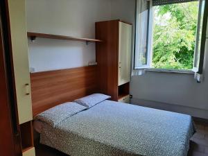 Postel nebo postele na pokoji v ubytování Pensione TOSCA B&B Cattolica