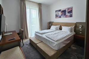 Postel nebo postele na pokoji v ubytování Iaki Conference & Spa Hotel