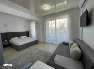 Postel nebo postele na pokoji v ubytování Sunrise apart hotel