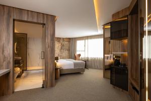 Idou Malabata Beach and SPA客房内的一张或多张床位