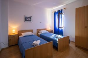 Łóżko lub łóżka w pokoju w obiekcie Apartments Gaja blue ap