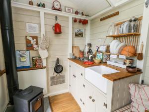 a kitchen with a sink and a stove at Sika in Dorchester