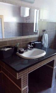 a bathroom with a sink and a mirror at Apartment Nada in Kastav +8 photos
