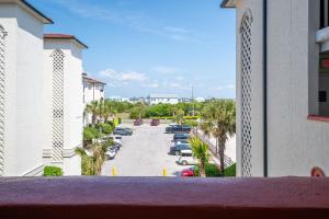 a view from a balcony of a parking lot at Villa Capriani 218B Oceanfront with Pool at North Topsail Beach in Chadwick Acres