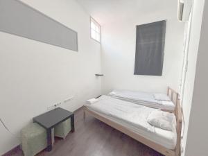 Posteľ alebo postele v izbe v ubytovaní Artist Guest House