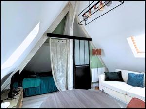 Ένα ή περισσότερα κρεβάτια σε δωμάτιο στο Le Perchoir "Cozy Appart"